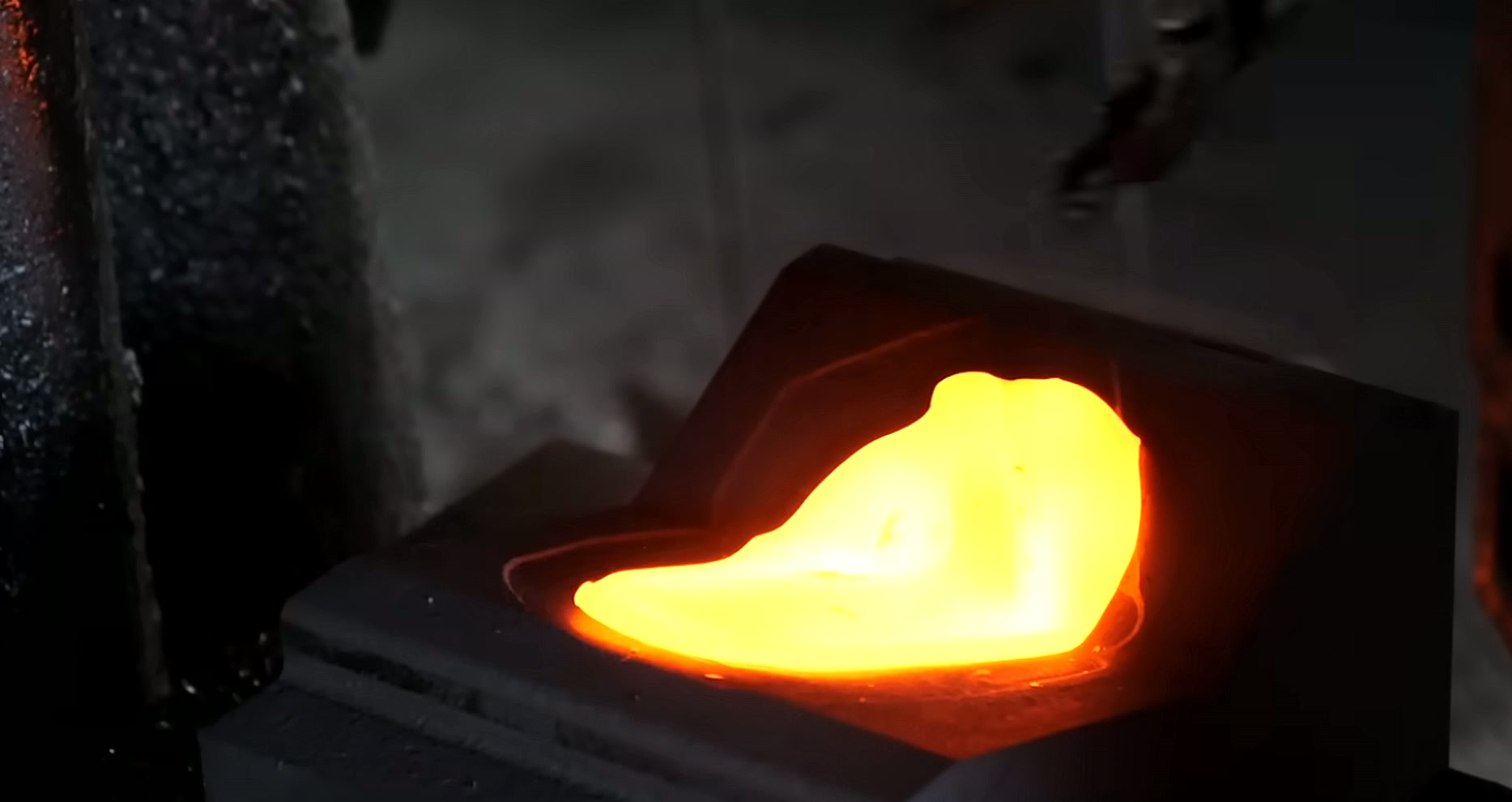 Hot steel billet under the forging press